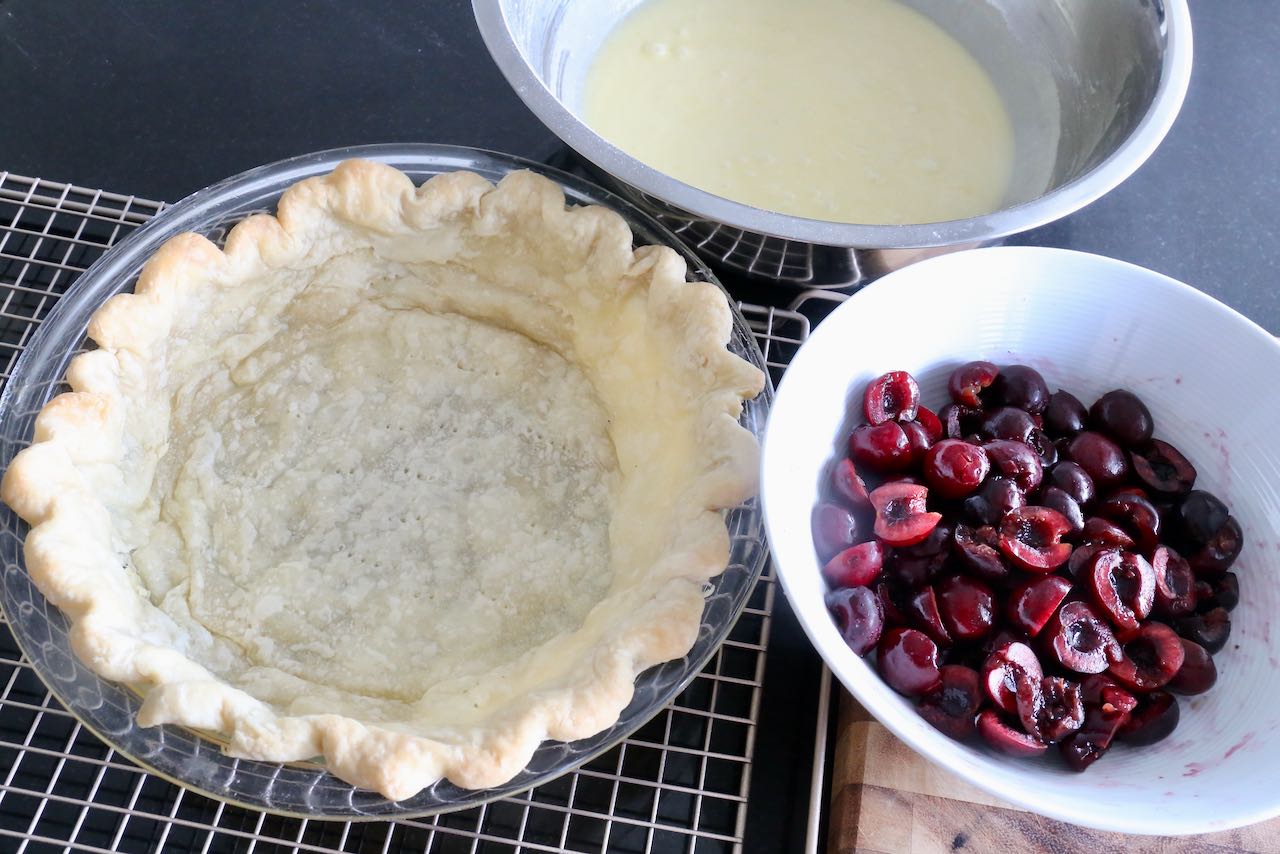 Prebake the pie crust then fill with custard and sliced fresh cherries. 
