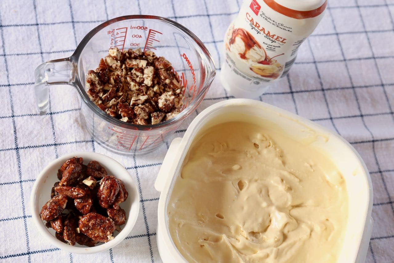 Pralines and Cream Ice Cream is made of homemade vanilla ice cream, chopped praline pecans and caramel sauce.