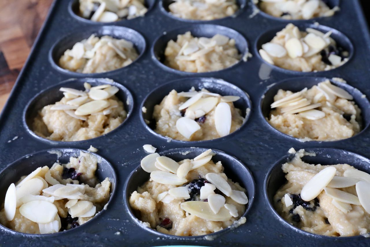 Top each muffin cup with slivered almonds before baking.