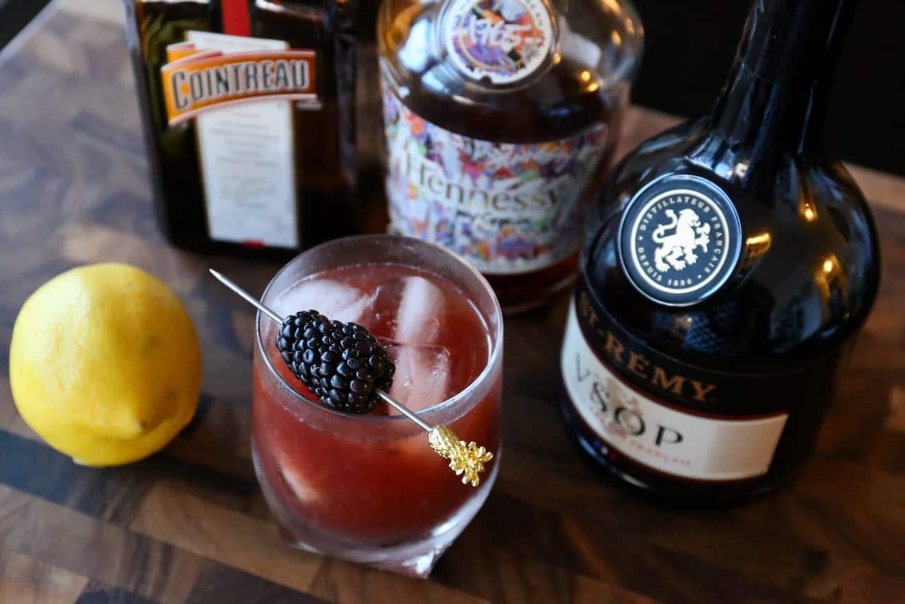 This homemade brandy cocktail is flavoured with blackberry jam and garnished with a fresh blackberry.