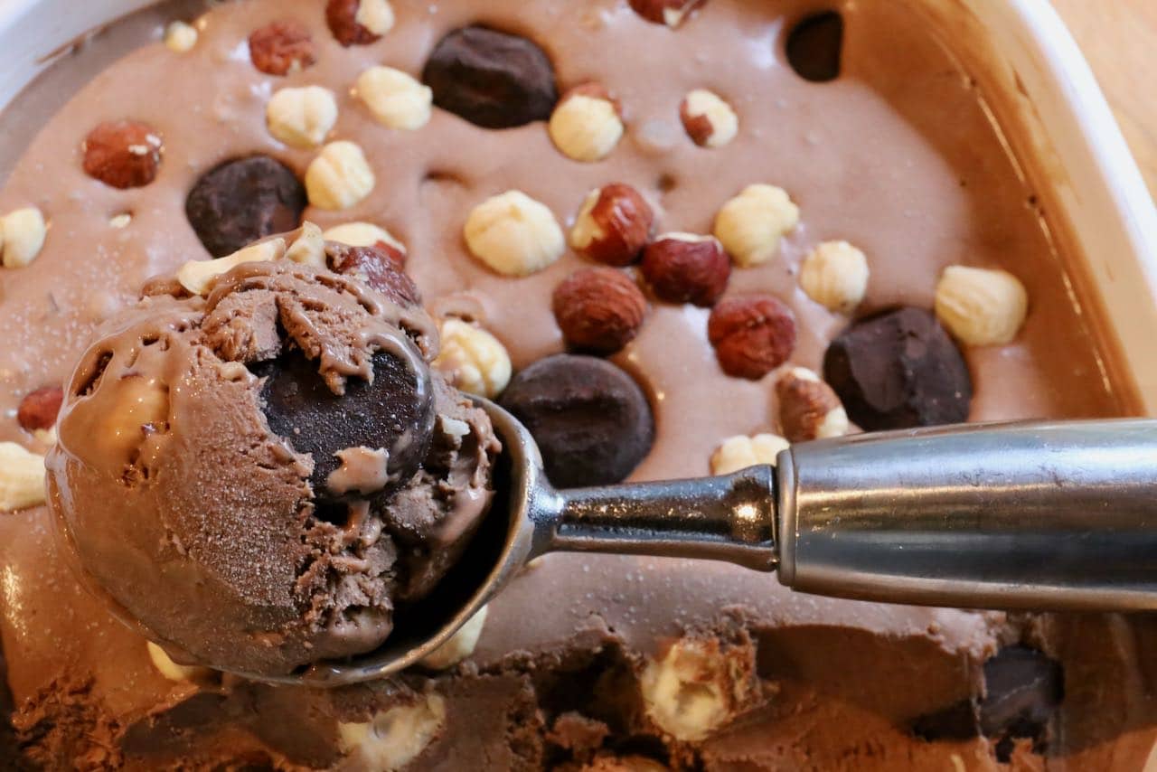 Our Truffle Ice Cream recipe scoops easily, revealing a rich and creamy frozen dessert.