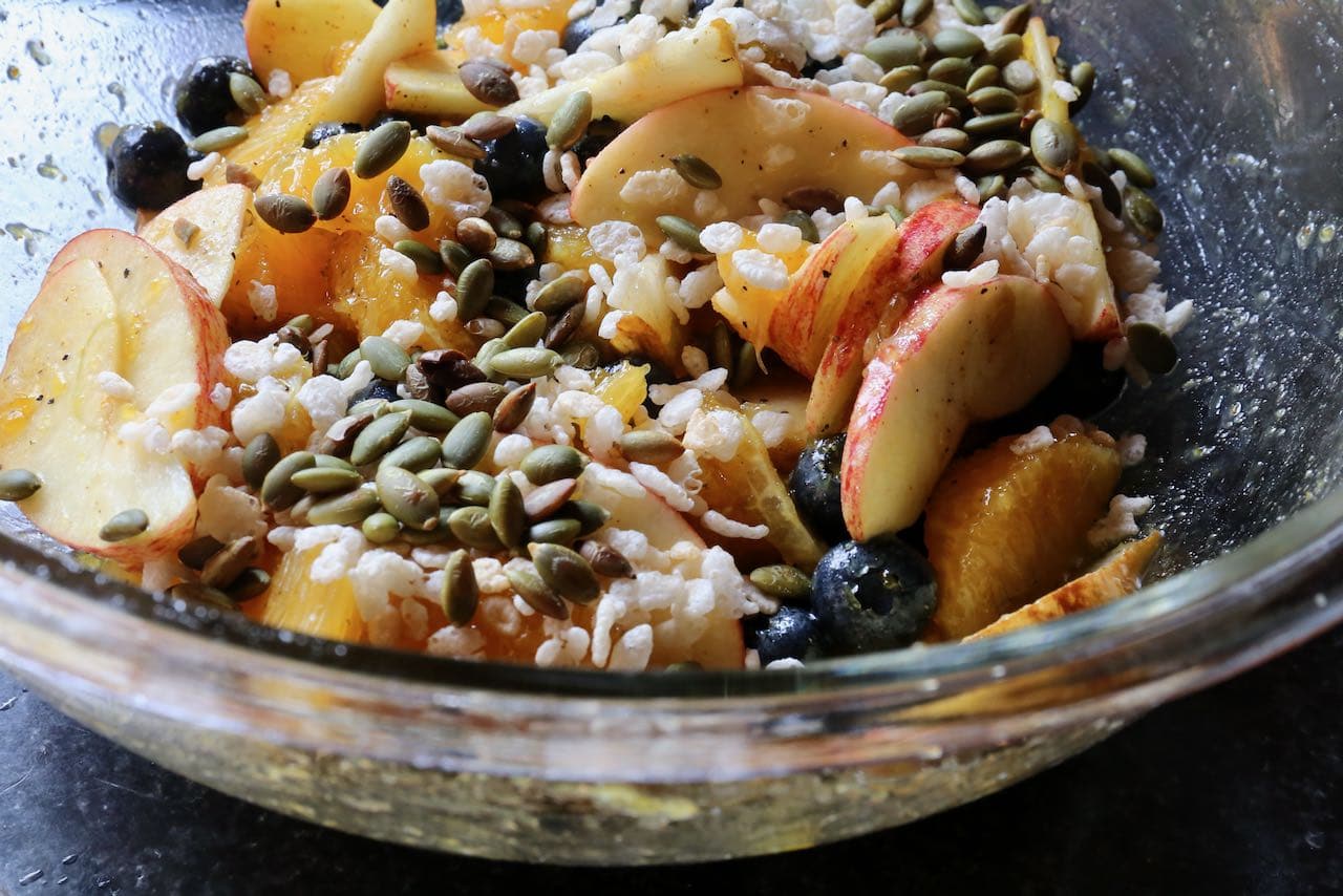 Garnish Fruit Chaat Masala with crunchy puffed rice and toasted pumpkin seeds for a delicious crunchy texture.