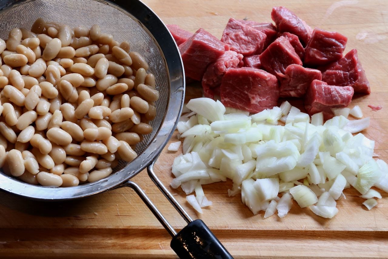 Turkish Kuru Fasulye features stewing beef, onions and beans.