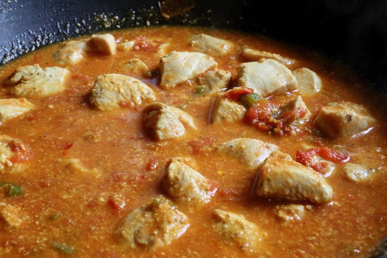Make Karahi Chicken on the stove in a large wok.
