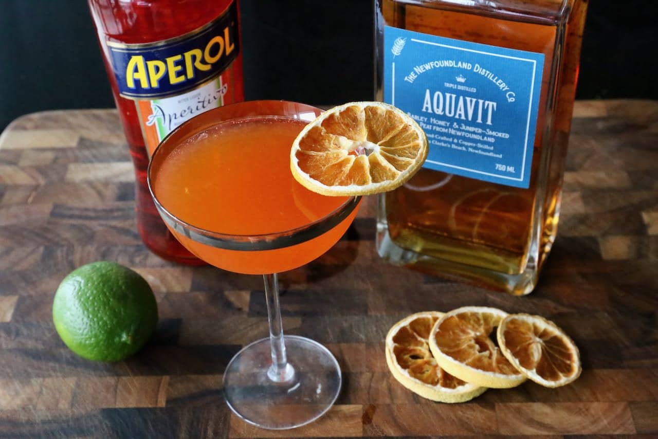 Garnish the Aquavit Cocktail with dehydrated citrus wheel.