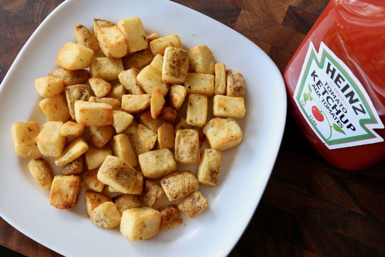 Serve air fryer home fries with ketchup as an easy brunch side dish.