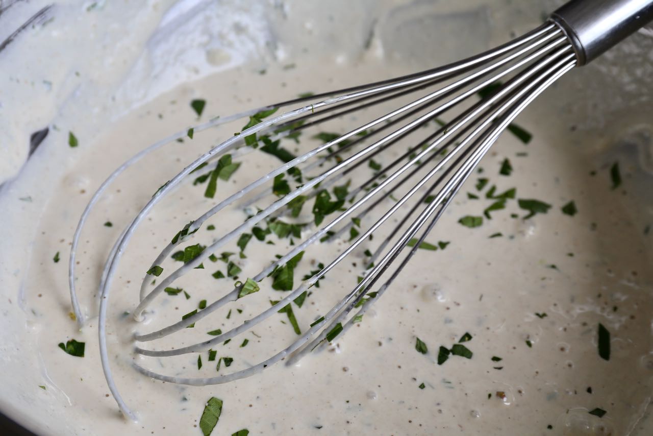 Whisk Lemon Herb Tahini Dressing ingredients until fully combined and creamy in texture.