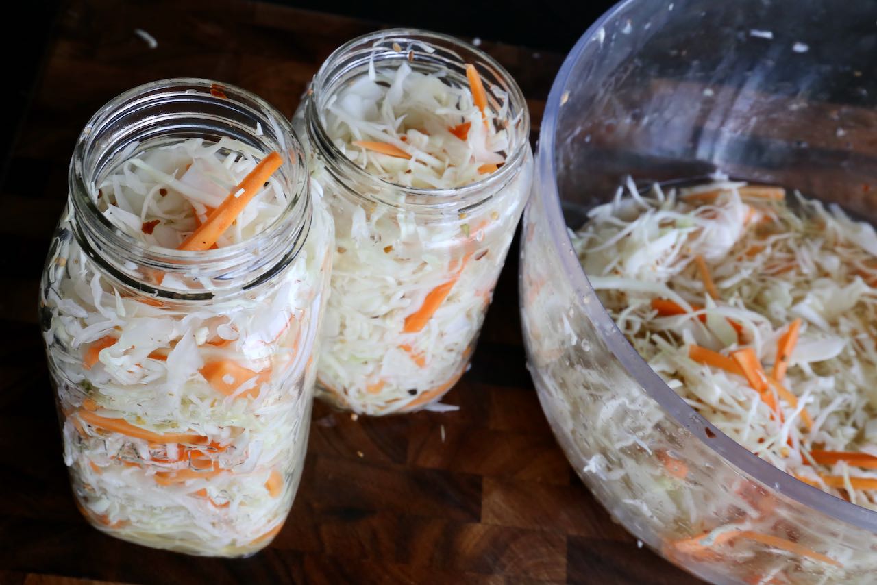 Ensure Quick Pickled Carrots and Cabbage are submerged in brine before storing in the fridge.