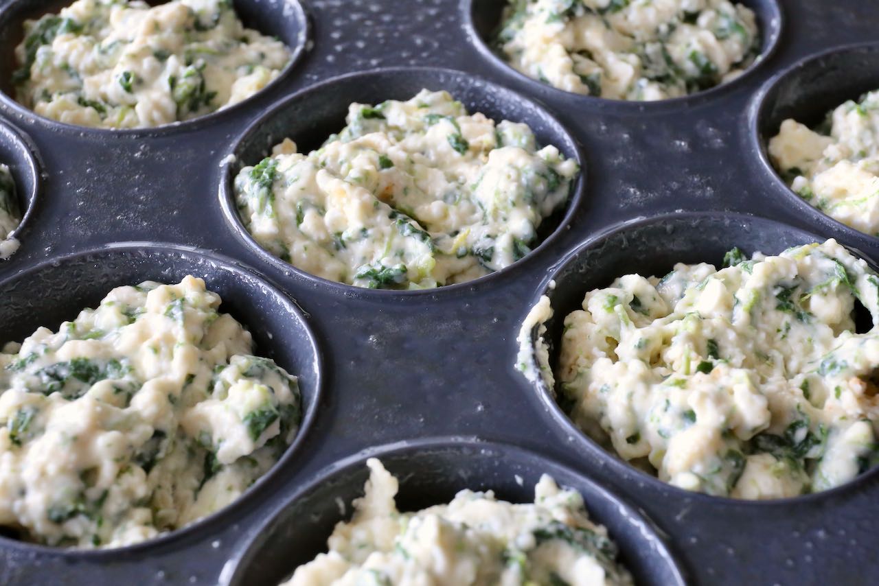 Scoop spinach and feta cheese batter into greased muffin cups.