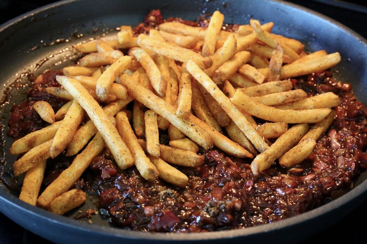 Toss crispy French Fries in the masala sauce. 