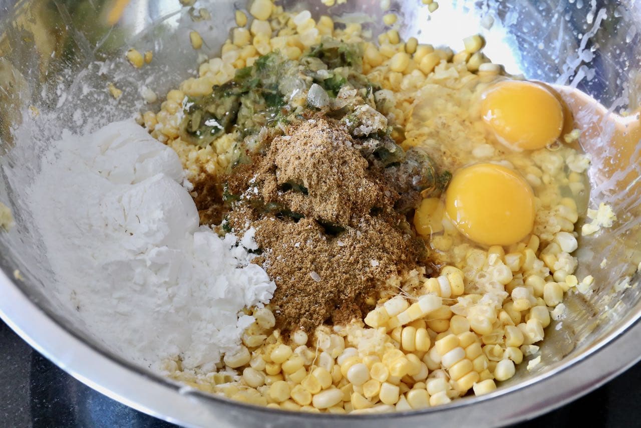In a mixing bowl combine corn, eggs, cornstarch, chili and spices.