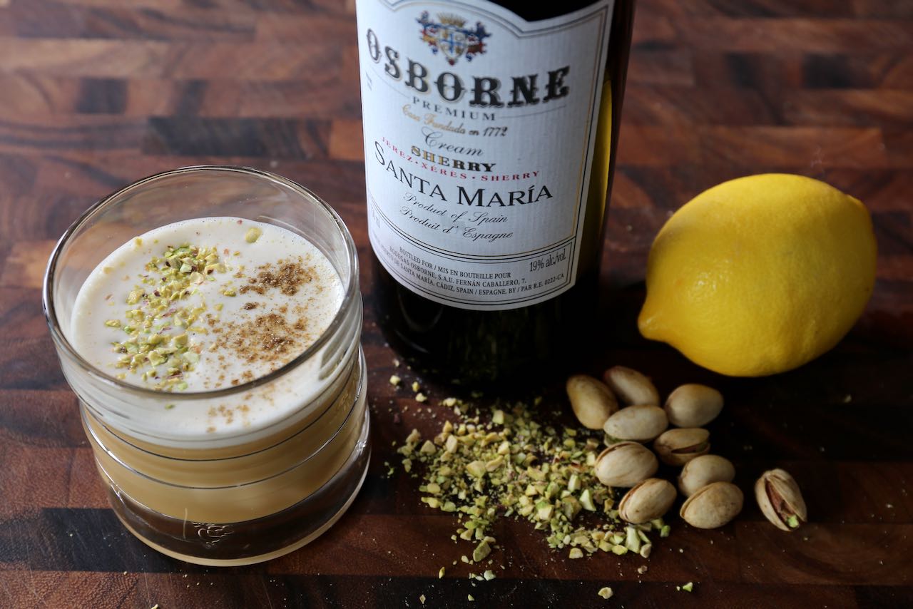 Garnish the Sherry Flip with chopped pistachio and sprinkle of cardamom spice. 