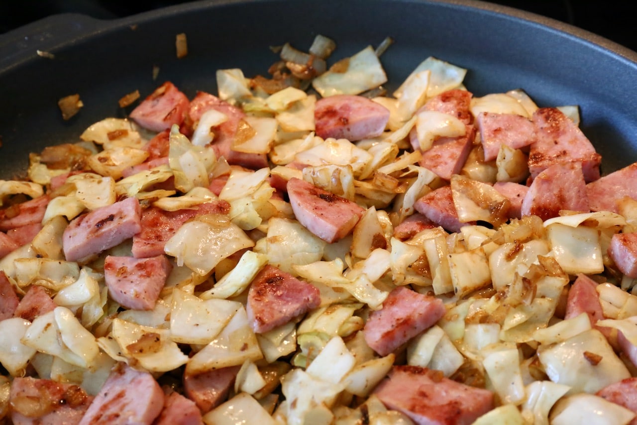 Cook the Breakfast Cabbage and kielbasa sausage until tender and browned. 