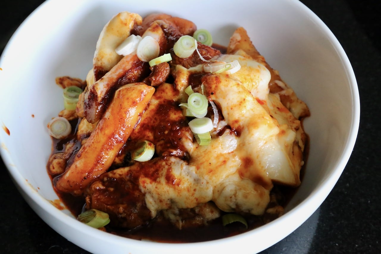 We like to serve this easy Tteokbokki with Cheese recipe garnished with sliced scallions.