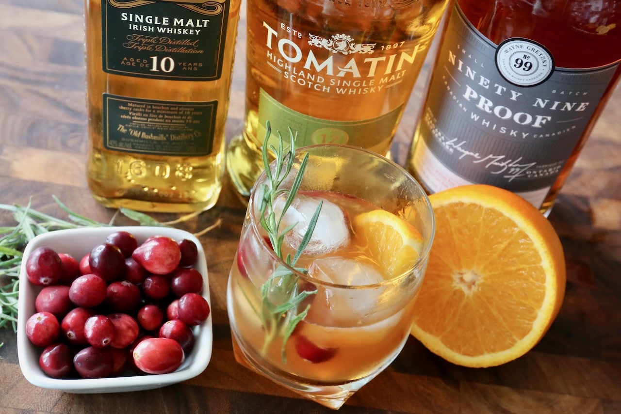 Serve this easy Christmas Old Fashioned Cocktail garnished with a rosemary sprig. 