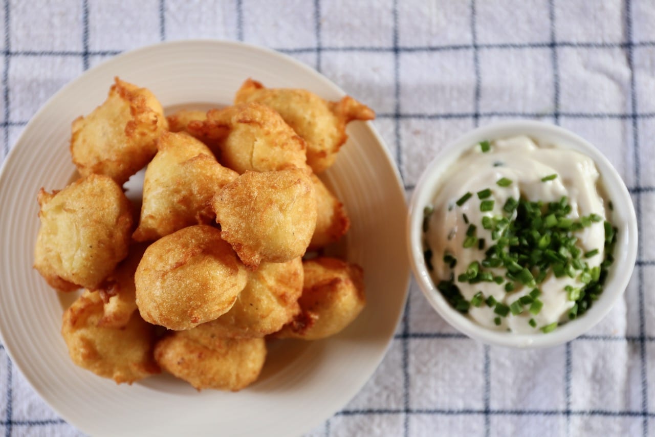 Serve French potato fritters as a side dish with roasted red meat or chicken. 