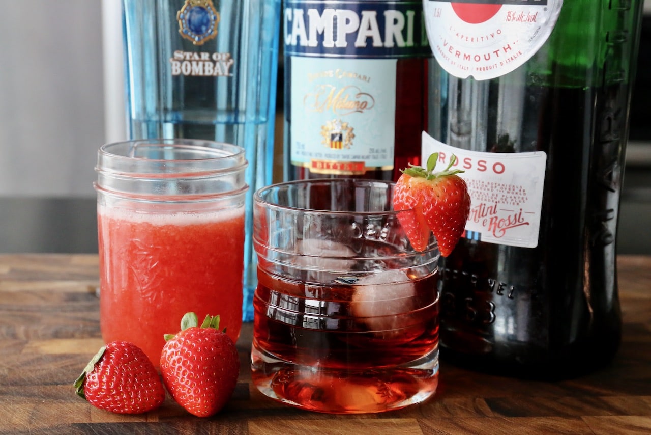 This Negroni cocktail recipe features homemade strawberry infused simple syrup.