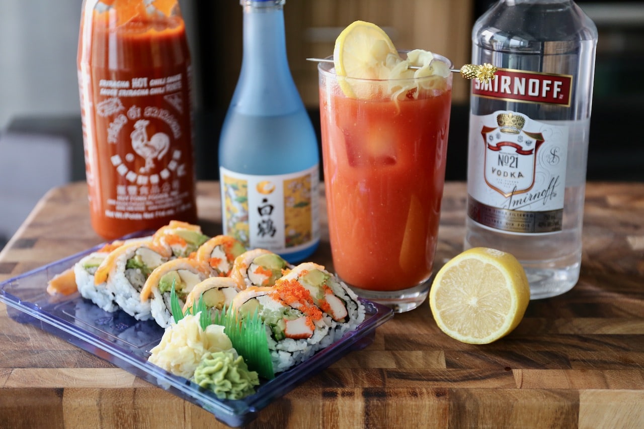 This spicy Sushi Cocktail features sake, vodka, sriracha hot sauce, lemon and tomato juice. 