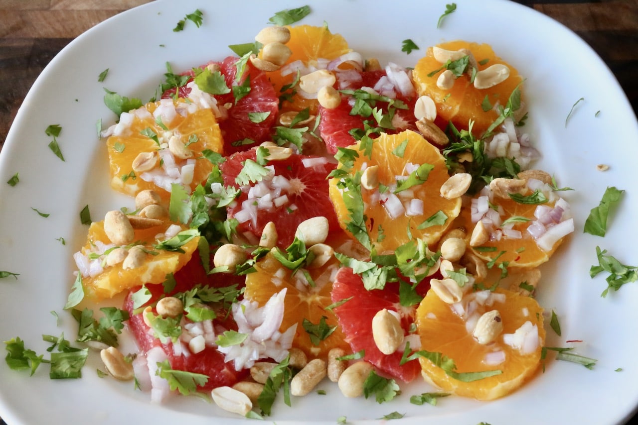 Garnish this eye-popping colourful citrus salad with roasted peanuts and cilantro.