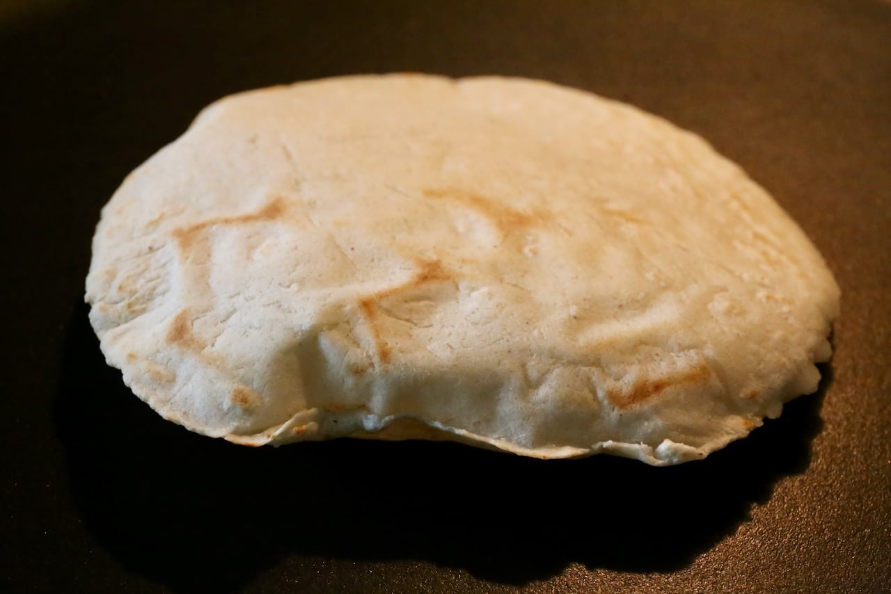 Tortillas de Maiz is finished cooking once it puffs up and is browned on the outside.
