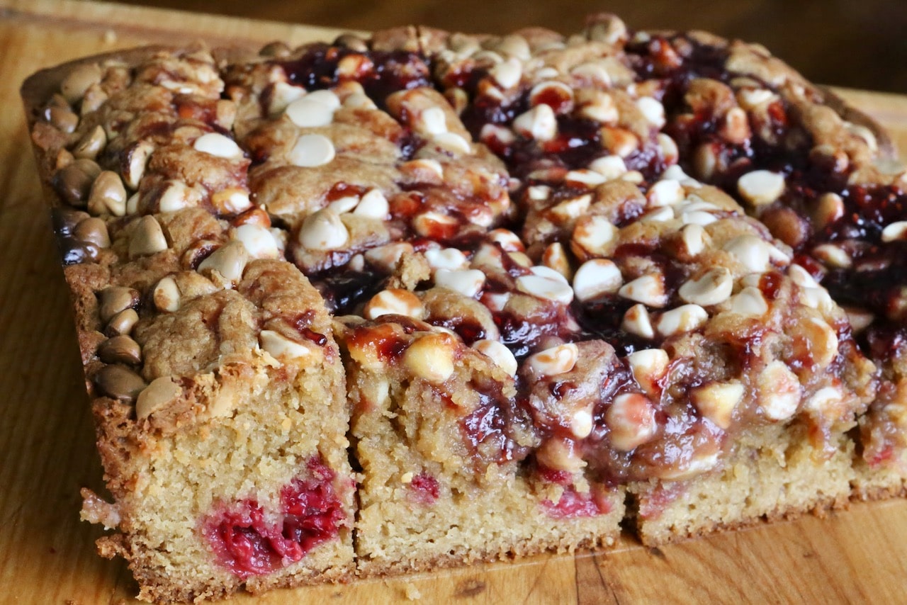 Cut White Chocolate Raspberry Blondies into squares or rectangles.