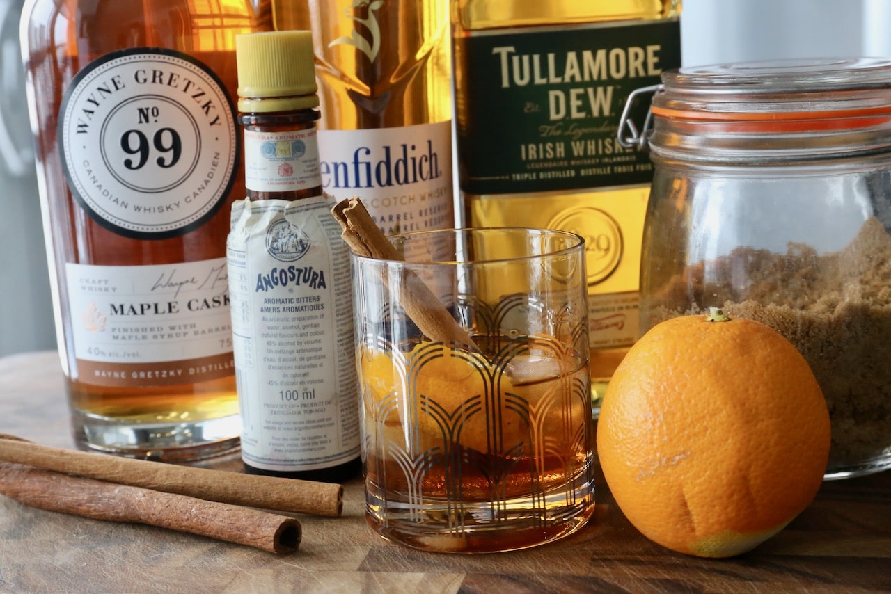 This festive Old Fashioned recipe is perfect for the holidays featuring cinnamon and orange peel.