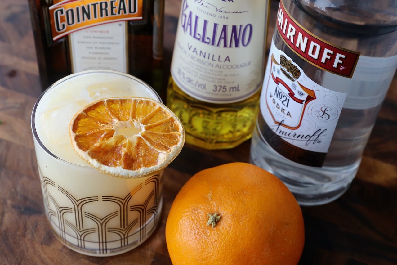 Garnish a Dreamsicle Cocktail with dehydrated or fresh orange slices. 