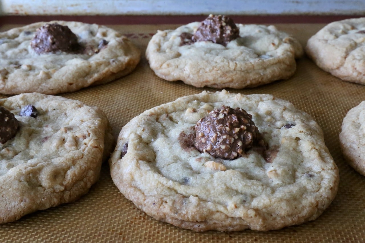 Ferrero Rocher cookies feature chocolate chips and chopped roasted hazelnuts.