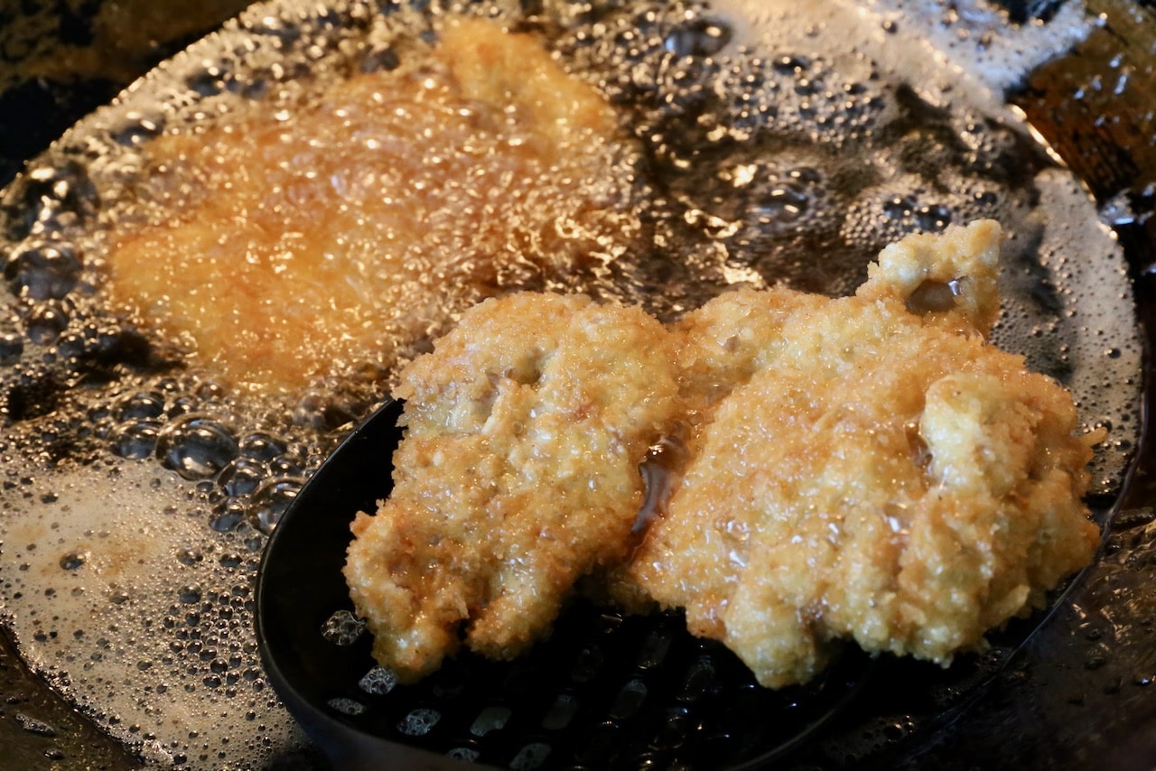 Deep fry Japanese-style breaded chicken katsu. 