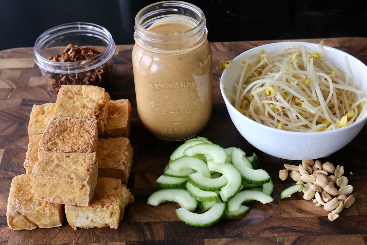 Our easy Tahu Goreng recipe features fried tofu, cucumber, bean sprouts, peanut sauce and fried shallots.