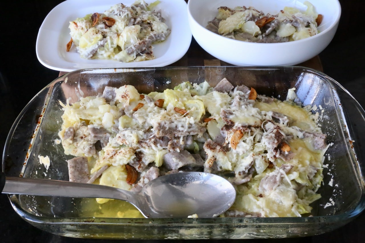 Top Pizzoccheri alla Valtellinese with garlic butter and sprinkle with parmesan cheese before baking.