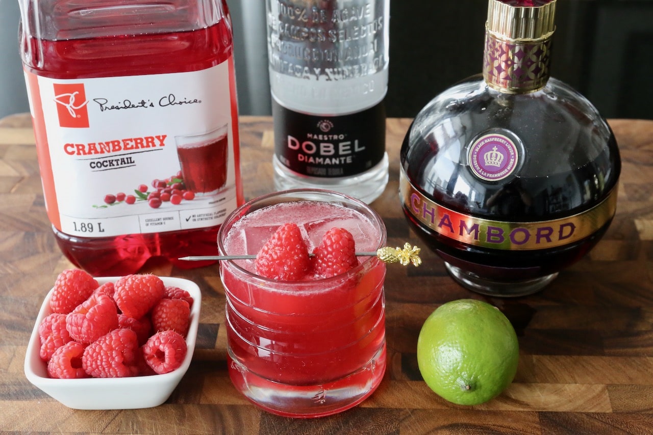 This easy Chambord Margarita recipe features tequila, cranberry juice, lime juice and fresh raspberries.