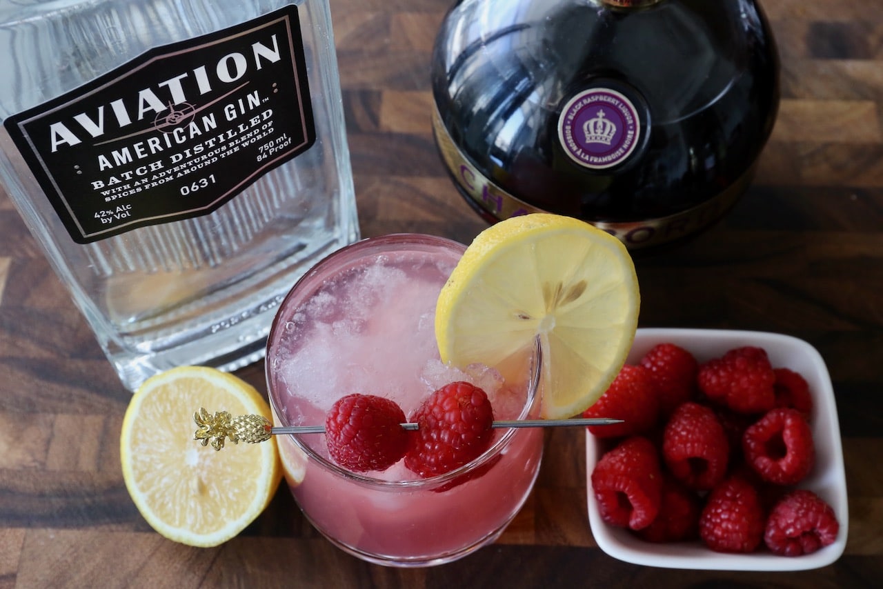Garnish a Chambord Bramble with a lemon wheel and fresh raspberry cocktail pick.
