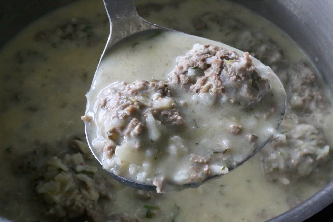 Youvarlakia is a Greek soup featuring a creamy broth flavoured with lemon.