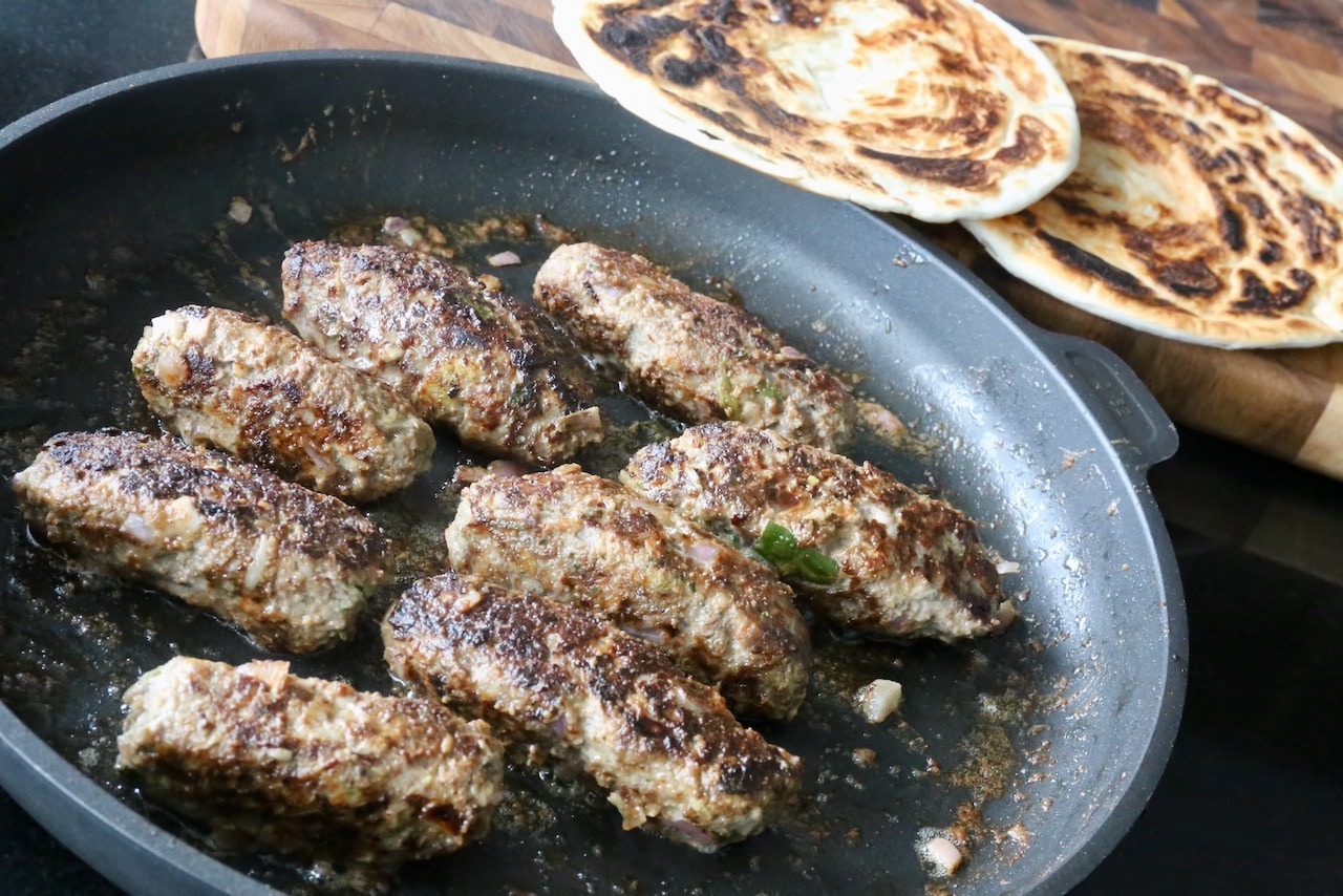 Kebab Rolls are prepared with flaky paratha flatbread. 