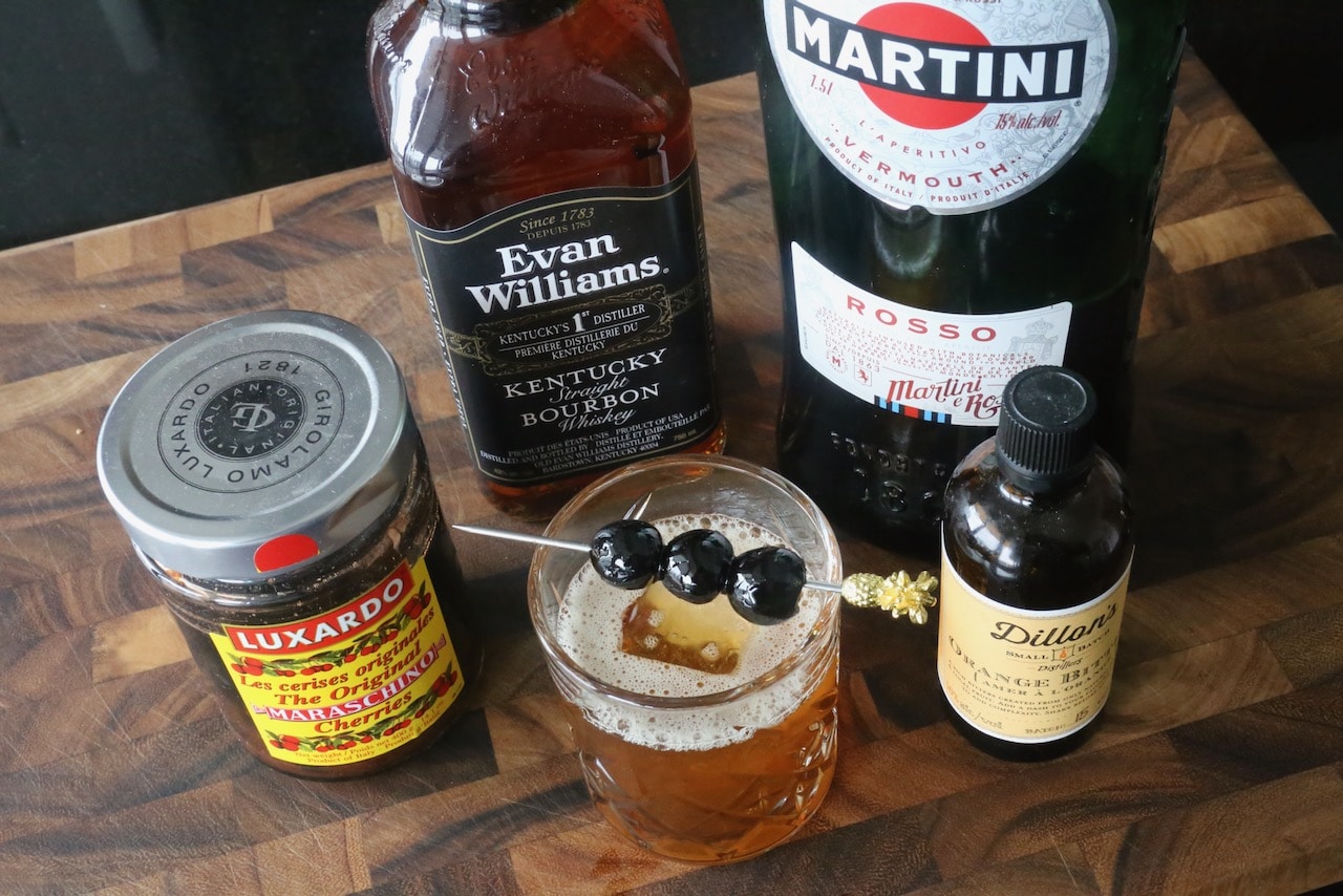 Serve a classic Bourbon Manhattan garnished with maraschino cherries.