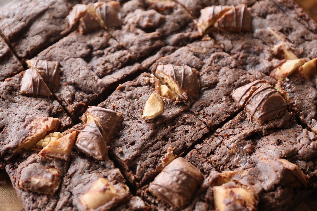 Slice Kinder Bueno Brownies into squares before serving.