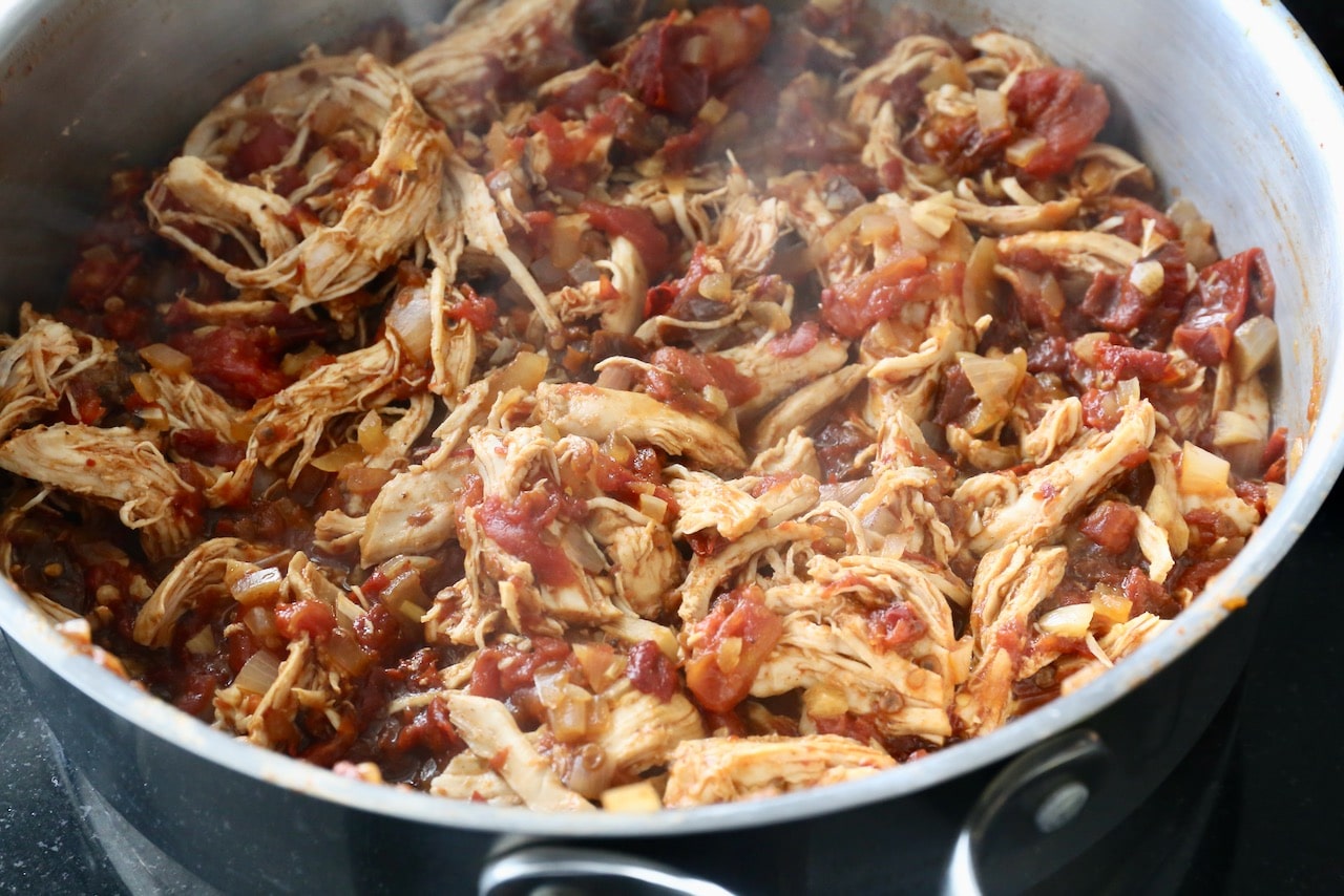 In a skillet cook shredded chicken with onion, garlic, chipotle chile and tomatoes. 