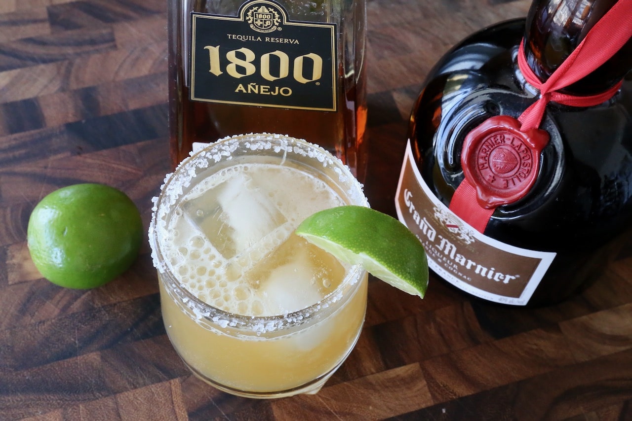 Serve the Mexican drink in a rocks glass with salt rim and lime wedge garnish.