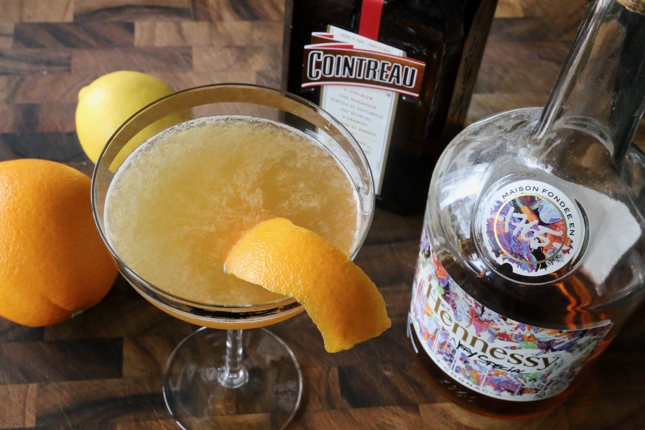 Serve this cognac cocktail in a coupe glass garnished with an orange peel.
