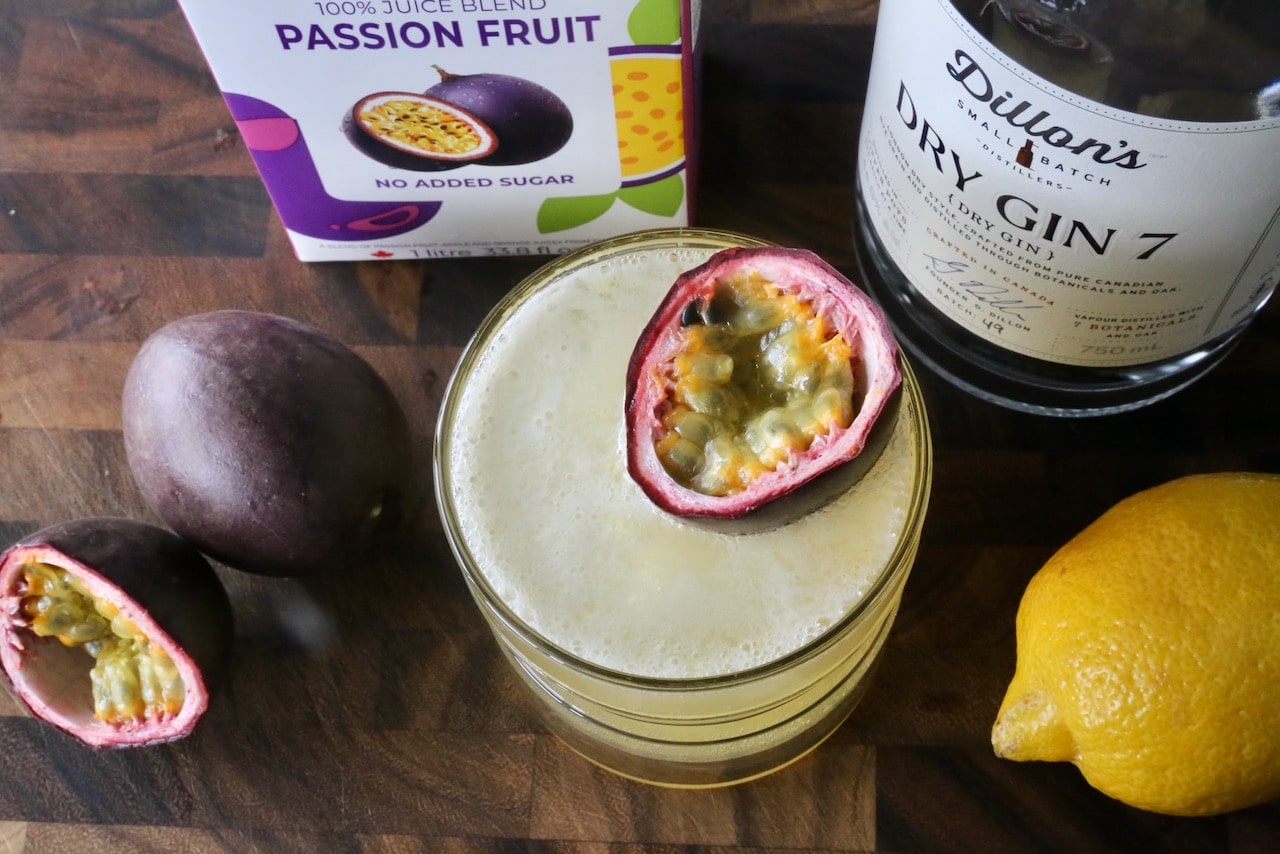 Garnish the drink with a passion fruit float.
