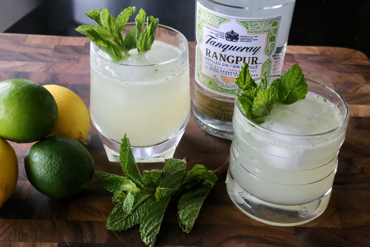 Garnish the cocktail with a sprig of fresh mint.