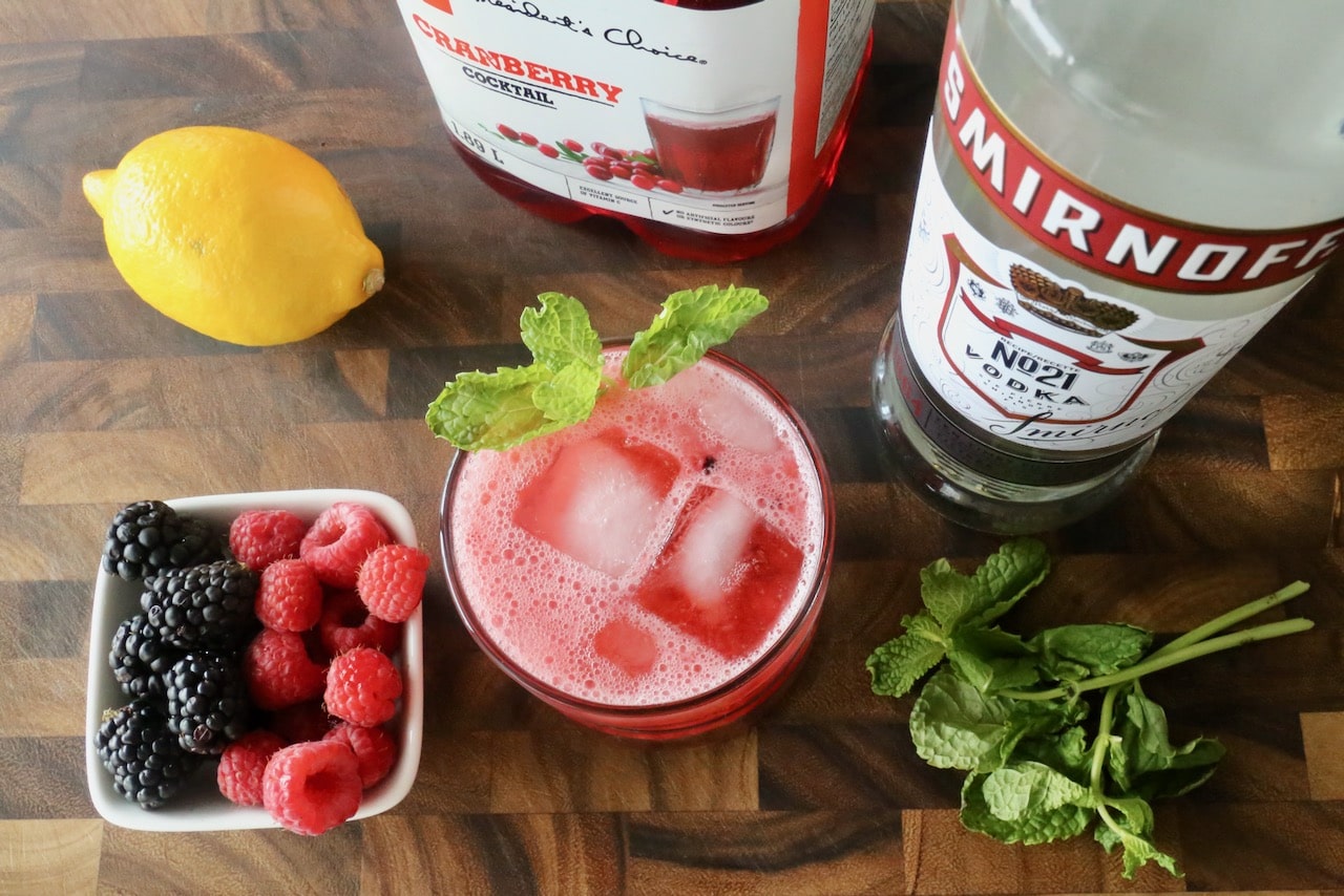 Garnish a Berry Vodka Spritzer with a fresh mint sprig.