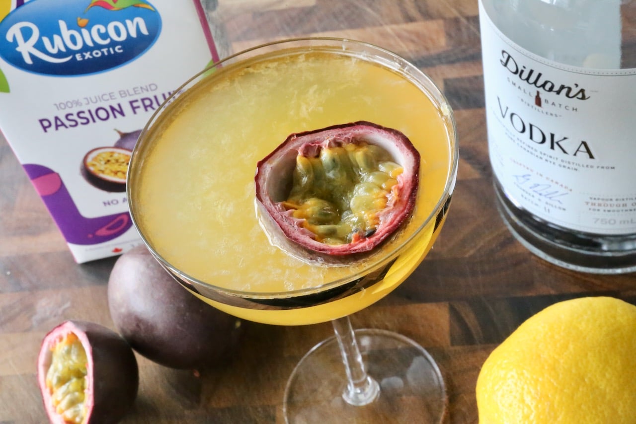 Garnish the drink with a passion fruit float.
