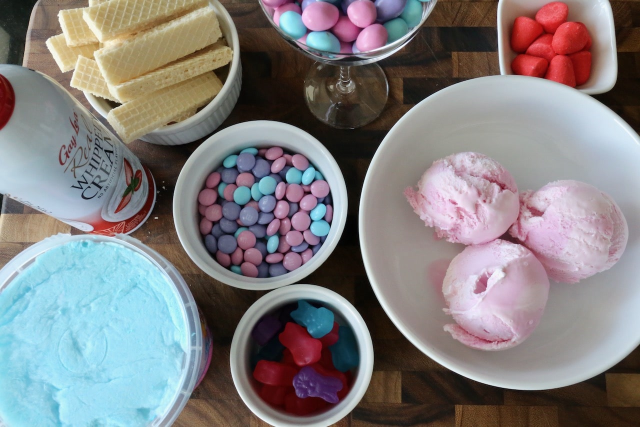 Ice Cream Sundae DIY station features whipped cream, wafer cookies and pastel coloured candies.