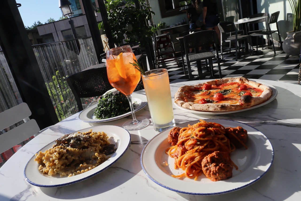 Enjoy pasta and pizza at Trattoria Nervosa Rooftop Patio in Yorkville.