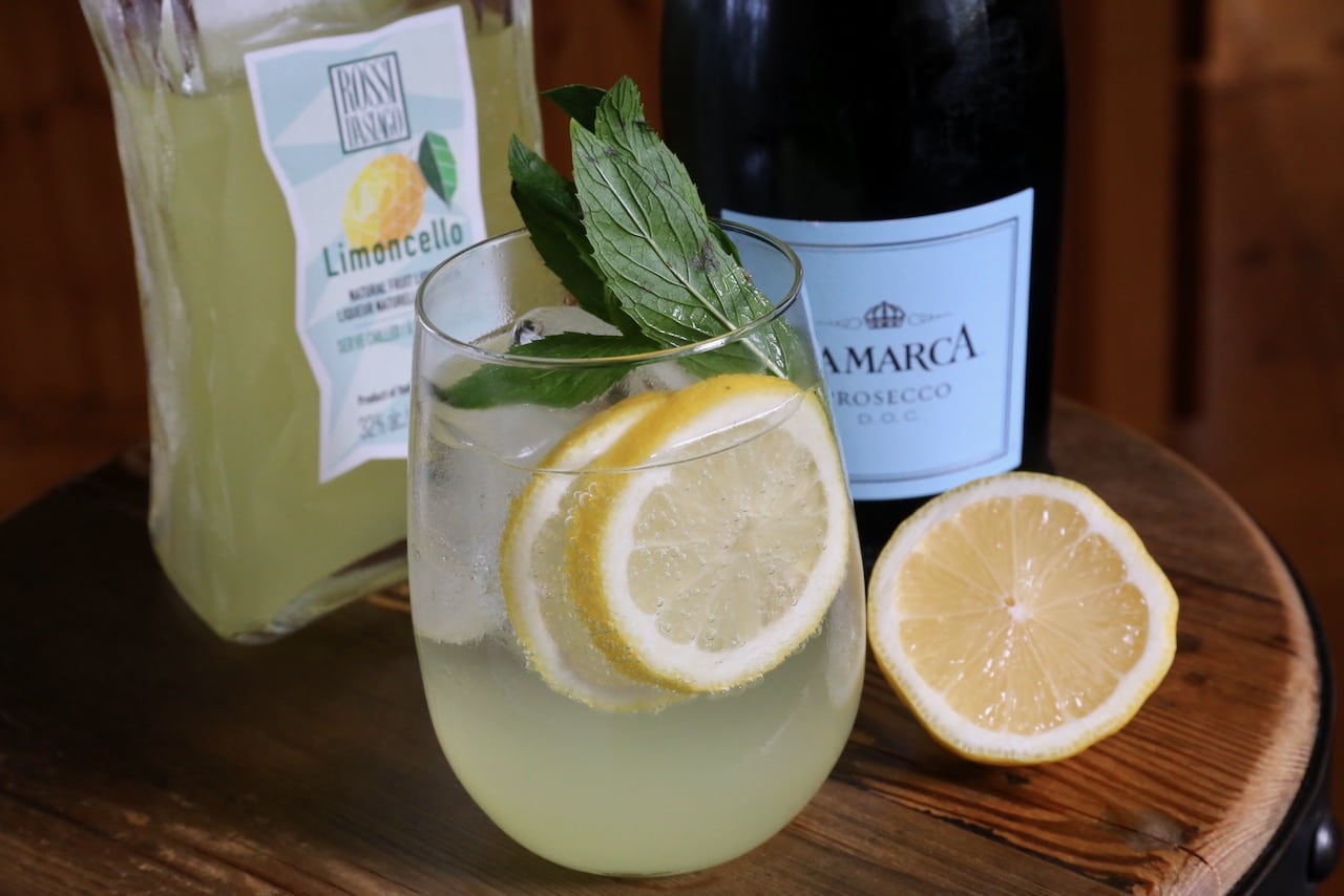 Garnish each glass with lemon wheels and fresh mint sprigs.