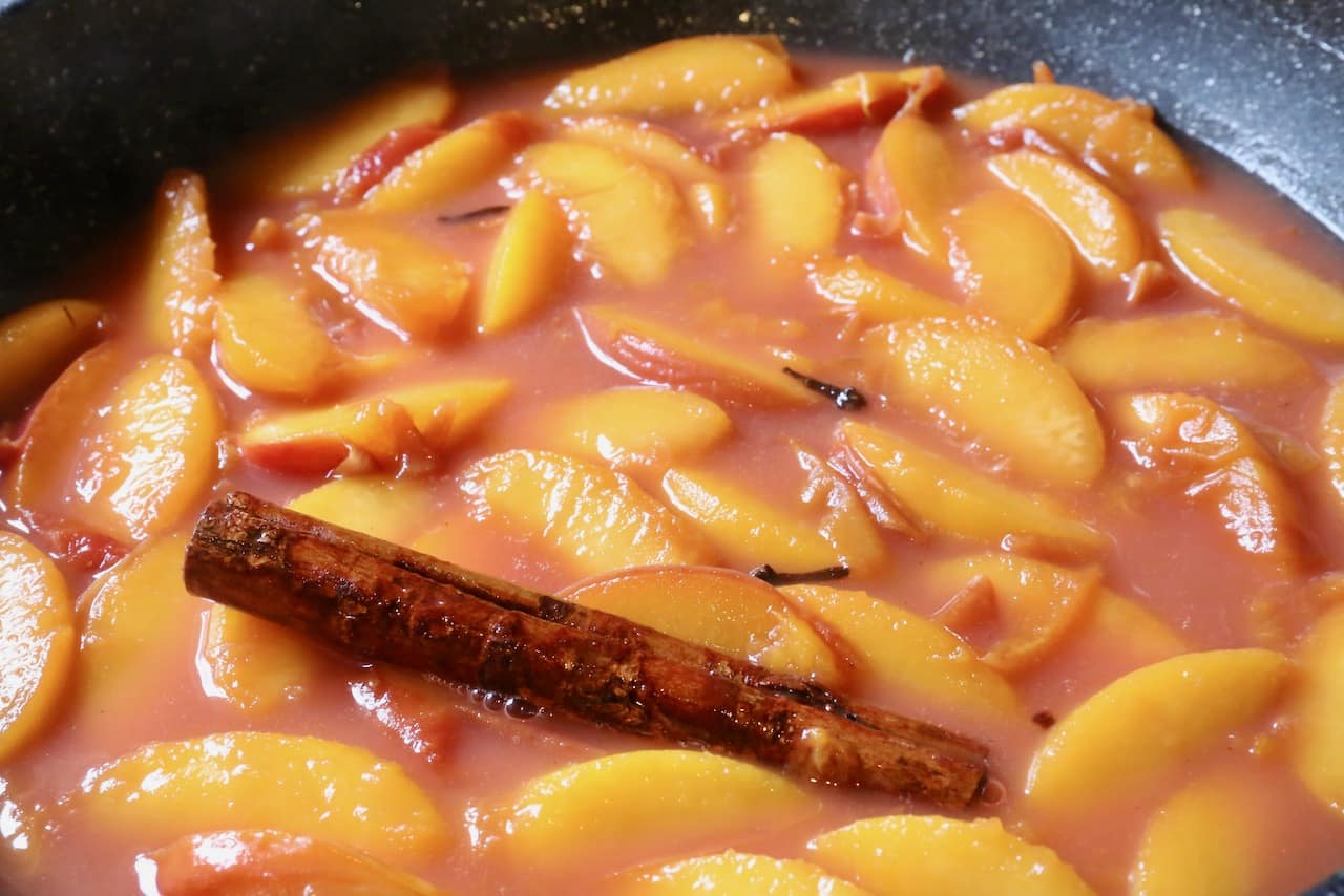 Stew Peach Compote until the fruit is fork tender and the syrup has thickened.