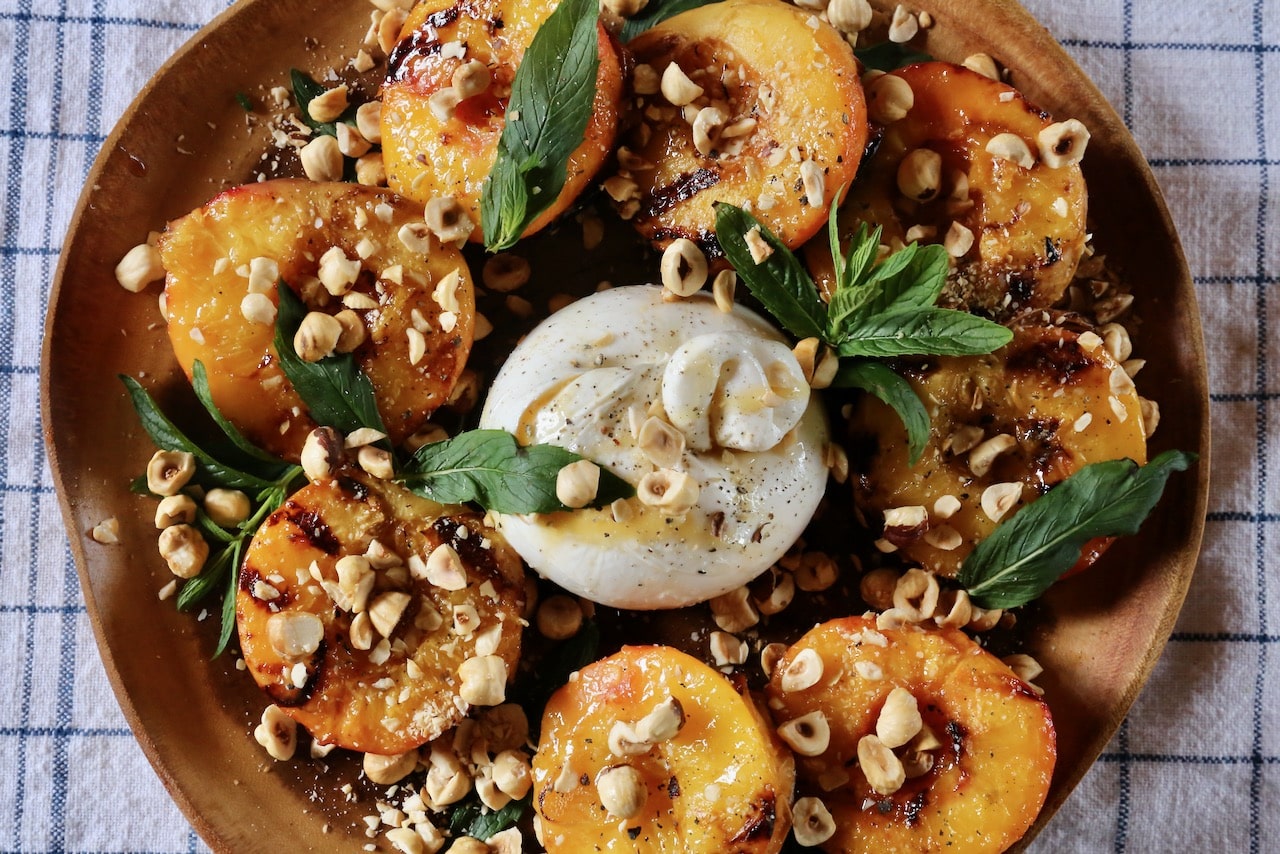 We love to make Grilled Peaches and Burrata in the summer during stone fruit season.