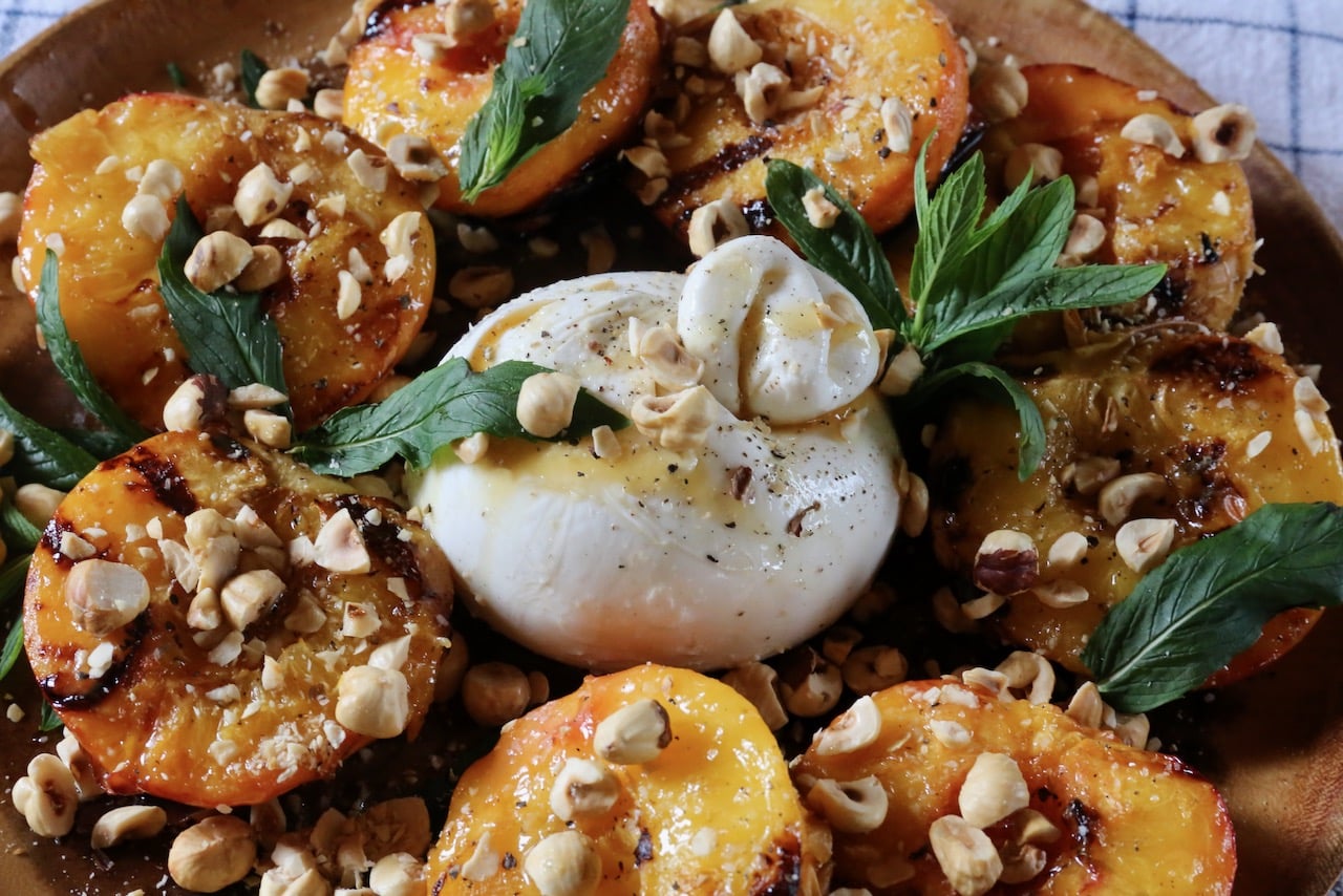 If you're hosting a dinner party serve Grilled Peaches and Burrata on a large serving platter. 